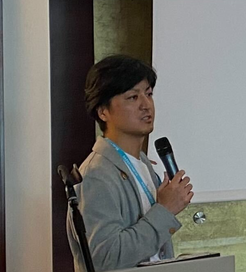 Yutaka Matsubara speaking at a lecture